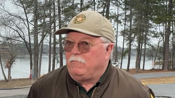 Putnam County Sheriff Howard Sills talks to reporters at Lake Oconee on Feb. 15 in the midst of a search for missing boater Gary Jones. (Joe Kovac Jr / AJC)