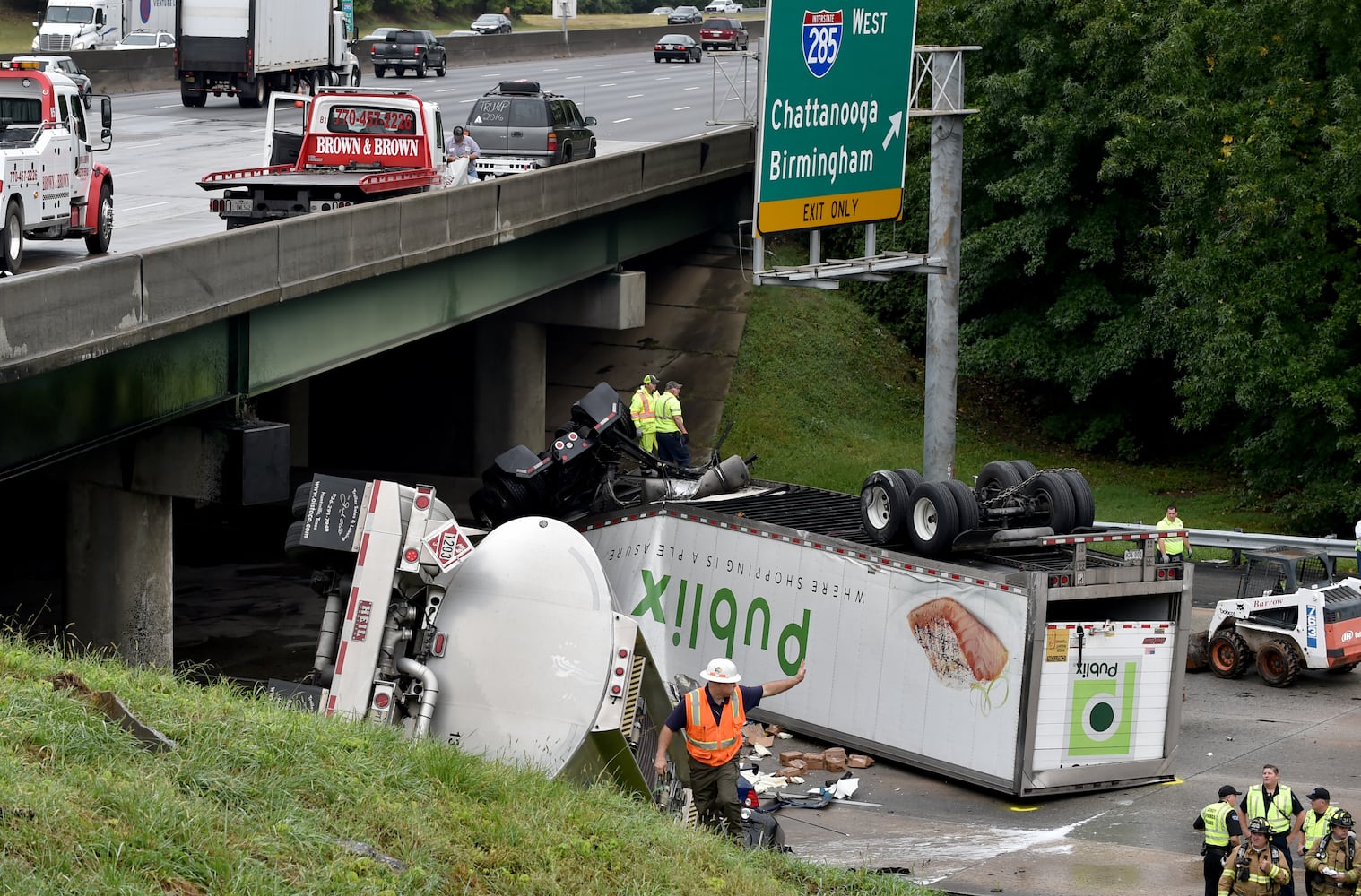 I-285 crash: Trucks plunge off interstate onto Ga. 400