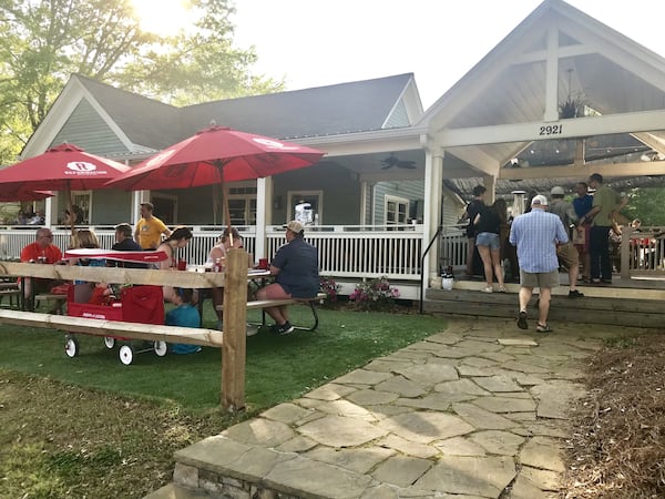 Located a few blocks off Kennesaw’s historic downtown Main Street, the Nest makes its home in two renovated 1880s clapboard houses connected by a long, covered porch that opens to a patio. A row of picnic tables line the front lawn. LIGAYA FIGUERAS / LFIGUERAS@AJC.COM