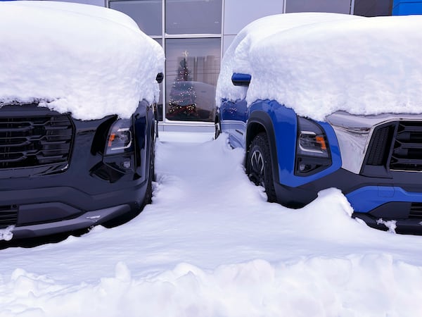 Vehicles are covered during a snow storm in Lowville, N.Y., on Sunday Dec, 1, 2024. (AP Photo/Cara Anna)