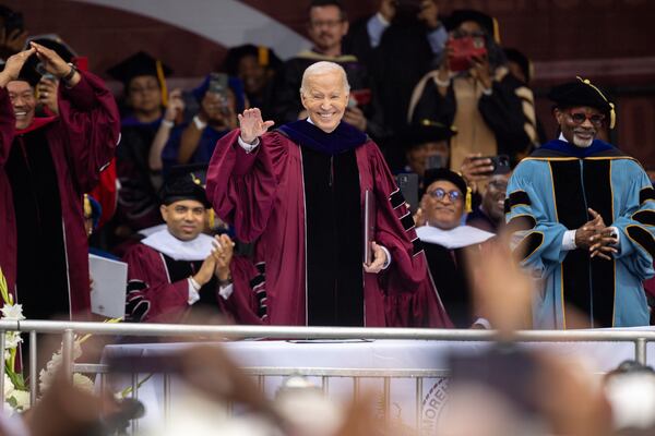 President Joe Biden waves at alumni at the commencement ceremony at Morehouse College in Atlanta on Sunday, May 19, 2024. (Arvin Temkar / AJC)