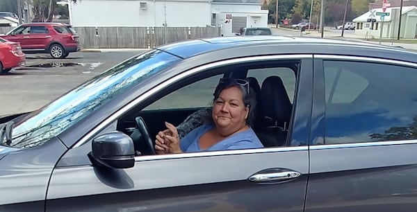 Jami Ragan, in a CVS parking lot in Monticello on Nov. 9, 2020, said she voted for Donald Trump because she's worried about losing various freedoms under Joe Biden. (Andy Peters / andy.peters@ajc.com)