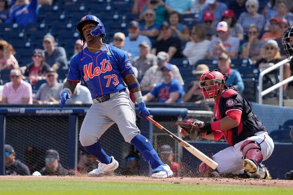 New York Mets' Luisangel Acuna singles during the second inning of a spring training baseball game against the Washington Nationals Monday, Feb. 26, 2024, in West Palm Beach, Fla. (AP Photo/Jeff Roberson)