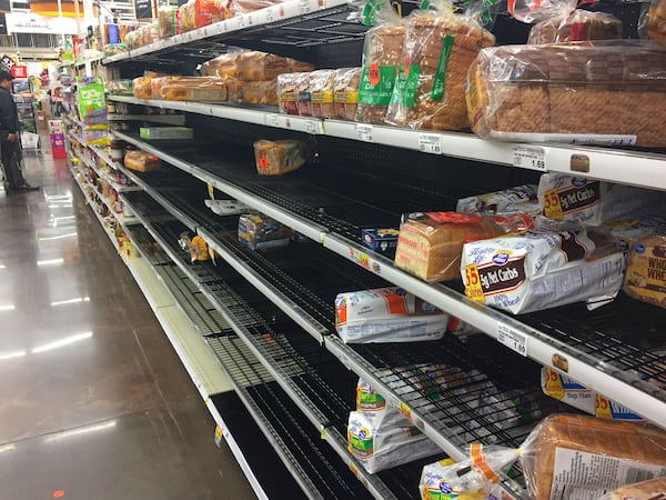 The bread aisle at a Kroger store in Peachtree City late Thursday shows the same pre-storm decimation that was common across the metro area.