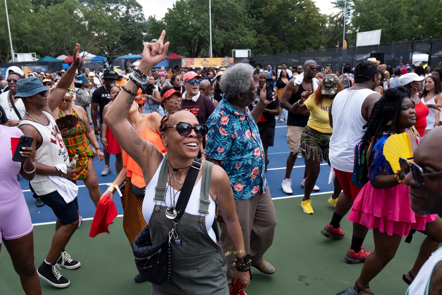 Annie Armstead dances to DJ Kemit during the 20th anniversary of the House In The Park music festival in Grant Park in Atlanta on Sunday, Sept. 1, 2024. (Ben Gray / Ben@BenGray.com)