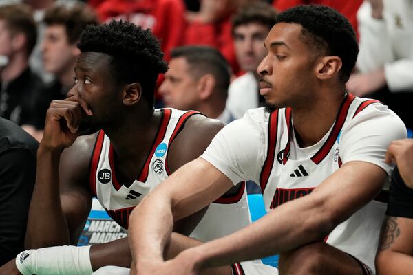 Louisville players watch the game against Creighton during the second half in the first round of the NCAA college basketball tournament, Thursday, March 20, 2025, in Lexington, Ky. (AP Photo/Brynn Anderson)