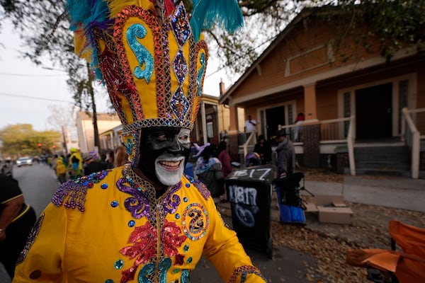 A member of the Zulu Tramps walks down Jackson Ave before the start of the Mardi Gras Day parade on Tuesday, March 4, 2025 in New Orleans. (AP Photo/Gerald Herbert)