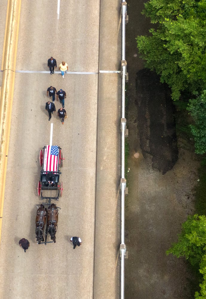 John Lewis crosses Edmund Pettus Bridge for final time