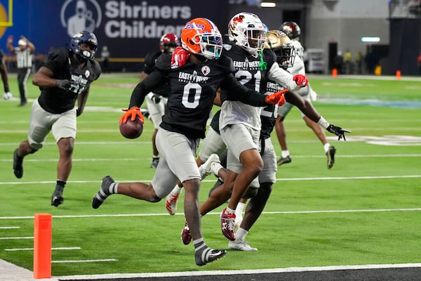 West safety Trey Dean III (0) of Florida celebrates after making an interception during the first half of the East-West Shrine Bowl NCAA college football game Thursday, Feb. 2, 2023, in Las Vegas. (AP Photo/John Locher)