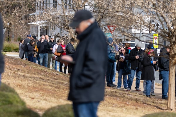 Voters wait in line at Milton Library in Milton on the last day of early voting on Friday, December 2, 2022.   (Arvin Temkar / arvin.temkar@ajc.com)