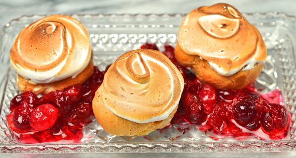 Eggnog Cream Puffs with Eggnog Pastry Cream and orange-scented cranberries. (Chris Hunt/Special)