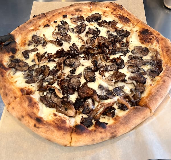 The Georgia Mushrooms pizza from Minnie Olivia in Alpharetta is loaded with local fungi and rounded out with taleggio and mozzarella cheeses. Courtesy of Minnie Olivia