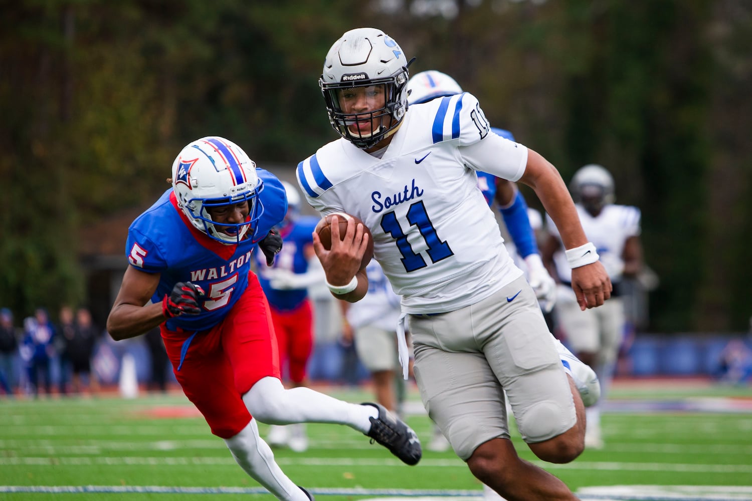 Ty Watkins, quarterback for South Forsyth, runs the ball. CHRISTINA MATACOTTA FOR THE ATLANTA JOURNAL-CONSTITUTION.