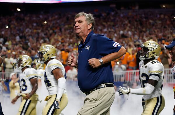 Georgia Tech head coach Paul Johnson runs onto the field with his players before in the first half of an NCAA college football game against the Tennessee Monday, Sept. 4, 2017, in Atlanta. (AP Photo/John Bazemore)