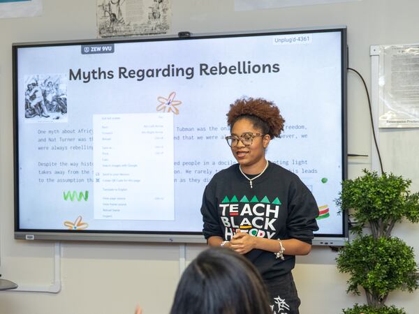 Kelsey Allen presents a portion of her class project to her Advanced Placement African American Studies class at Maynard Jackson High School in 2023.