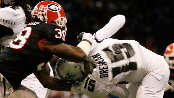 Georgia defensive end Marcus Howard (38) sacks Hawaii quarterback Colt Brennan (15)  in the first quarter of the Sugar Bowl Jan. 1, 2008, at the Superdome in New Orleans. (Pouya Dianat/AJC)