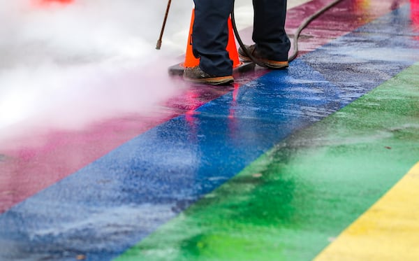 Black tire marks were cleaned off Midtown's rainbow crosswalks on Feb. 22, 2022, after street racers left behind damage. (John Spink / John.Spink@ajc.com)

