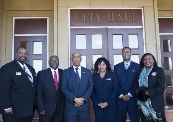 The Stockbridge mayor and City Council pose following a press conference in February 2018.