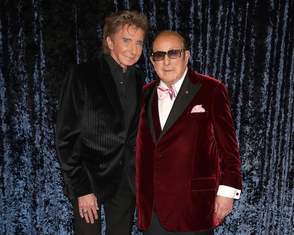 Barry Manilow, left, and Clive Davis attend Clive Davis' 90th birthday celebration at Casa Cipriani on Wednesday, April 6, 2022, in New York. (Photo by Greg Allen/Invision/AP)