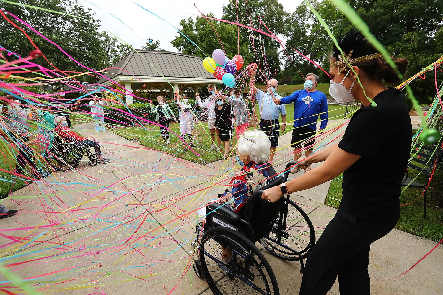 Photos: COVID-19 survivor celebrates 100th birthday