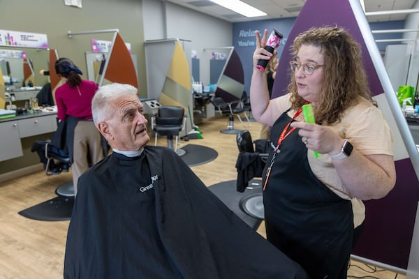 Salon Manager Susan Perdue (right) communicates with her clients by reading their lips in the mirror.  PHIL SKINNER FOR THE ATLANTA JOURNAL-CONSTITUTION