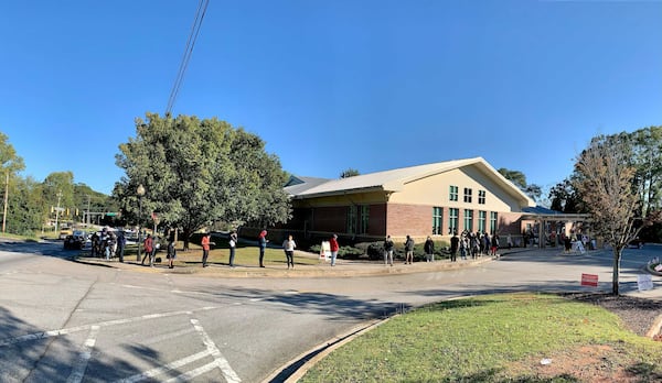 Voters wait to cast their ballots at the South Cobb Regional Library Friday afternoon. (HENRI HOLLIS/AJC)