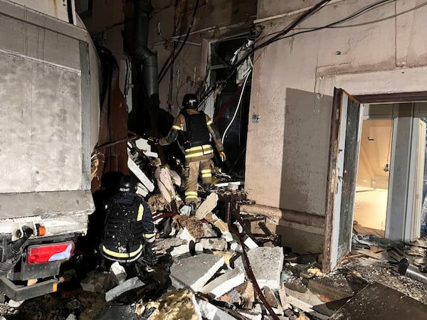 In this photo, provided by Dnipropetrovsk Oblast Governor Serhiy Lysak, firefighters work on the site of a damaged building after a Russian missile attack in Kryvyi Rih, Ukraine, Thursday, March 6, 2025. (Dnipropetrovsk Oblast Governor Serhiy Lysak via AP)