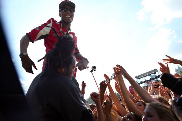 Sept 20, 2014 - ATLANTA - B.O.B. gets up close and personal with his audience during his performance from the Electric Ballroom Stage on Day 2 of Music Midtown at Piedmont Park on Saturday. (Akili-Casundria Ramsess/Special to the AJC) Atlanta's B.o.B. got the crowd jazzed when he got closer for a visit. Photo: Akili-Casundria Ramsess/Special to the AJC