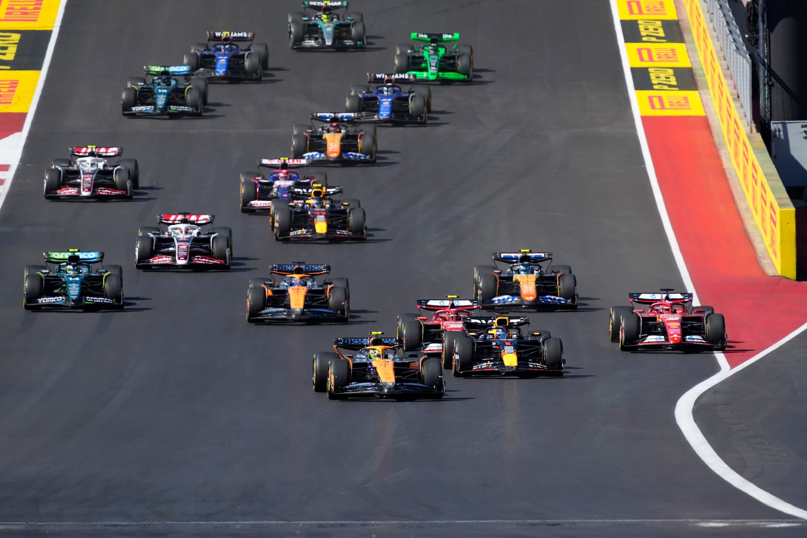 Drivers head into Turn 1 at the start of the U.S. Grand Prix auto race at Circuit of the Americas, Sunday, Oct. 20, 2024, in Austin, Texas. (AP Photo/Eric Gay)