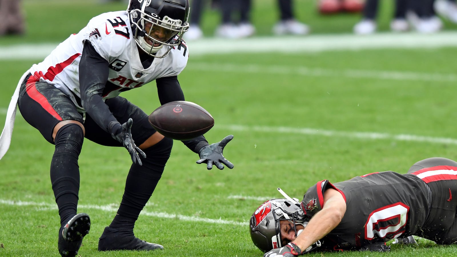 Atlanta Falcons free safety Ricardo Allen (37) intercepts a pass that was intended for Tampa Bay Buccaneers wide receiver Scott Miller (10) Sunday, Jan. 3, 2021, in Tampa, Fla. (Jason Behnken/AP)