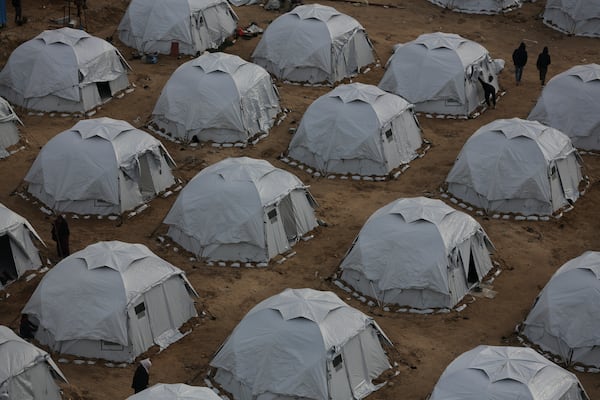 A tent camp for displaced Palestinians is set up amid destroyed buildings in the west of Al-Shati camp, west of Gaza City, on Monday, March 3, 2025. (AP Photo/Jehad Alshrafi)