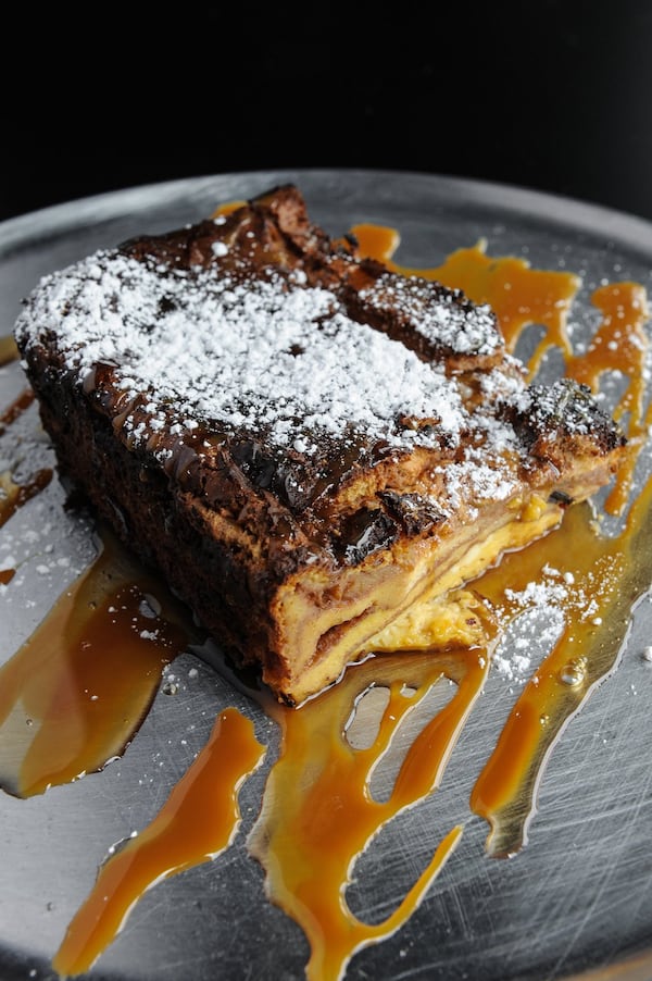 Decadent Challah French Toast Casserole with warm syrup and buttery caramel sauce at Oy! in Vinings. (Beckysteinphotography.com)