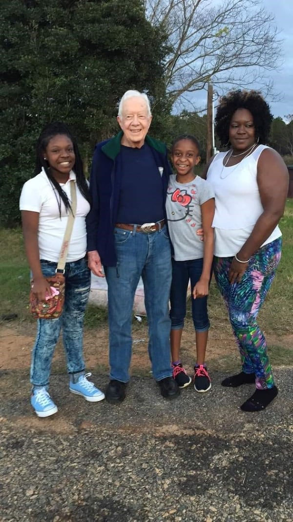 Many people who live in the small South Georgia city of Plains have met former president Jimmy Carter, who grew up there. Locals sometimes spoke with him when they see him out and about. Occasionally, they'd pose with him. Pictured from left to right, Nikerria Jackson, Carter, Passion Thomas and Shalonda Harris. SPECIAL