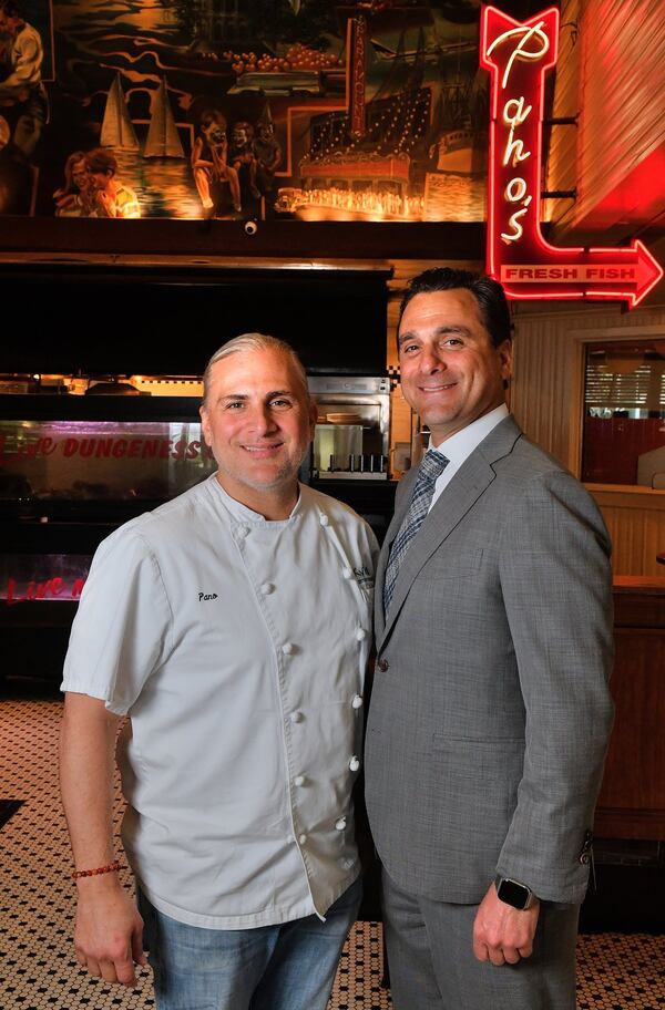 Brothers Pano I. (left) and Niko Karatassos inside the Atlanta Fish Market, which also houses the offices for the Buckhead Life Group. 