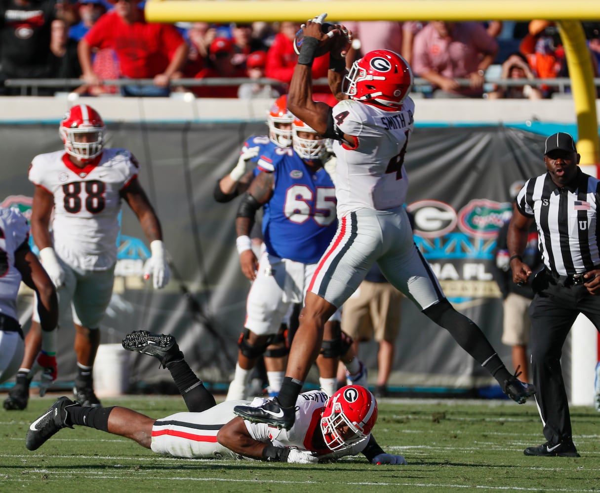 10/30/21 - Jacksonville -  Georgia Bulldogs linebacker Nolan Smith (4) intercepts a tipped ball that led to a Georgia scoring drive during the first half of the annual NCCA  Georgia vs Florida game at TIAA Bank Field in Jacksonville.   Bob Andres / bandres@ajc.com