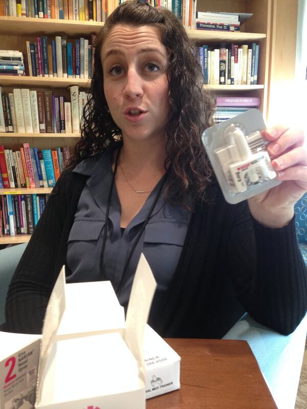 Mandy Wright, program manager of HAMSA, or Helping Atlantans Manage Substance Abuse, holds a tub of Narcan used in overdoses. HAMSA provides the antidote at no cost to partner organizations. GRACIE BONDS STAPLES / GSTAPLES@AJC.COM