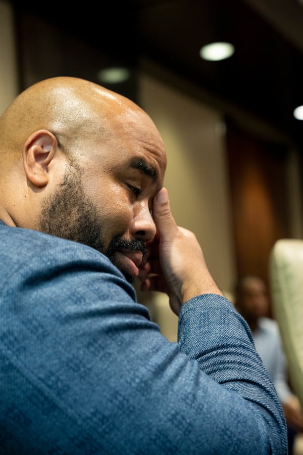 Atlanta entrepreneur Joey Womack tears up as Atlanta Mayor Andre Dickens and Google representatives present him with the inaugural Google for Startups Community Icon Award in Atlanta on Tuesday, June 20, 2023. Womack is the founder of Goodie Nation, a tech nonprofit that strives to eliminate the relationship gap that stands in the way of success for tech entrepreneurs and diverse founders. (Photo: Olivia Bowdoin, Atlanta Journal Constitution)