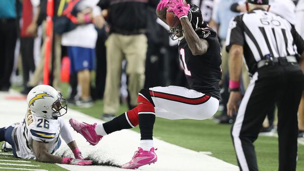 October 23, 2016 Atlanta: Falcons wide receiver Julio Jones is knocked out of bounds by Chargers cornerback Casey Heyward during over time as the official rules an incomplete pass in an NFL football game on Sunday, Oct. 23, 2016, in Atlanta.   Curtis Compton /ccompton@ajc.com