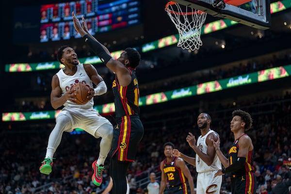 Cleveland Cavaliers guard Donovan Mitchell (45) attepts a slam dunk agaist Atlanta during the first half of an Emirates NBA Cup basketball game between the Cleveland Cavilers and the Atlanta Hawks on Friday, Nov. 29, 2024, in Atlanta. (AP Photo/Erik Rank)