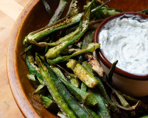 Crisp, tender strips of okra fries cooked in the air fryer are served with a spicy yogurt dipping sauce. (Virginia Willis for The Atlanta Journal-Constitution)