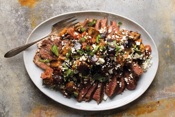 Flank Steak with Tomato-Eggplant Ragu, from "Milk Street: Tuesday Nights Mediterranean" (Voracious; 2021; $35). Courtesy of Connie Miller, CB Creatives Inc.