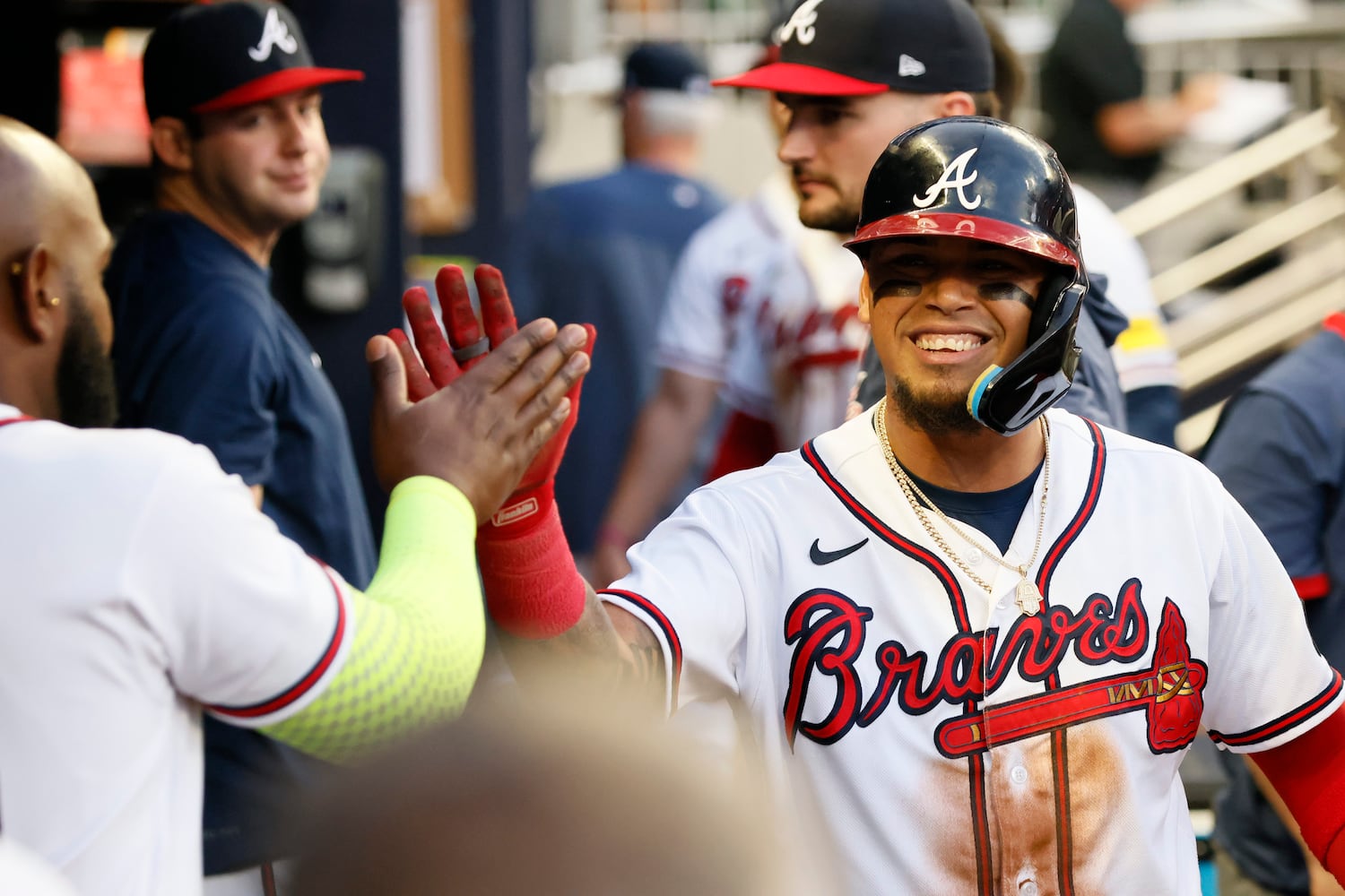 Designated hitter Marcell Ozuna (left) congratulates Braves shortstop Orlando Arcia after he scored during the fourth inning against the Colorado Rockies at Truist Park on Thursday, June 15, 2023, in Atlanta.
 Miguel Martinez / miguel.martinezjimenez@ajc.com 