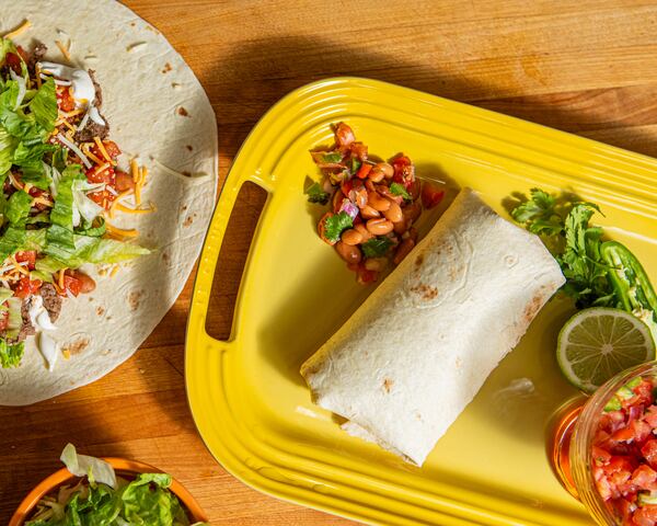 This lower-sodium burrito's satisfying flavor comes from fresh lime juice and homemade Pico de Gallo. (Aaliyah Man for The Atlanta Journal-Constitution / Food styling by Jennifer Hill Booker )