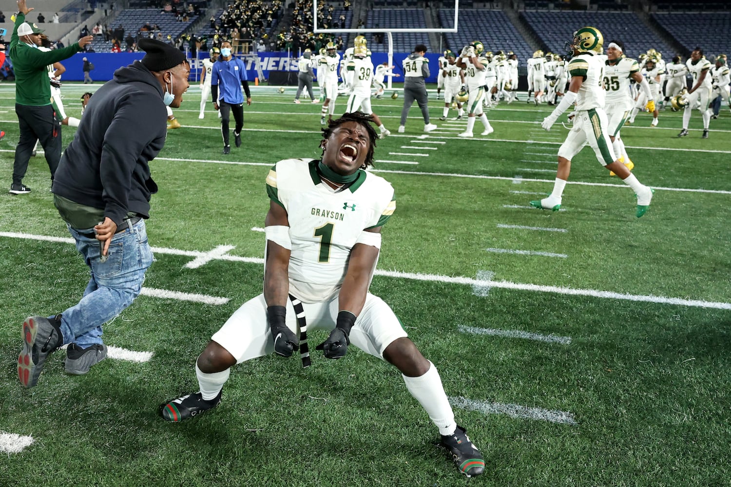 Grayson wide receiver Jamal Haynes (1) celebrates after their 38-14 win against Collins Hill during the Class 7A state high school football final at Center Parc Stadium Wednesday, December 30, 2020 in Atlanta. JASON GETZ FOR THE ATLANTA JOURNAL-CONSTITUTION