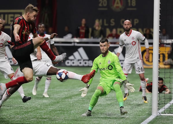 Toronto FC defender Chris Mavinga blocks a shot by Atlanta United midfielder Julian Gressel with goalkeeper Quentin Westberg defending during the final minutes in the Eastern Conference Final on Wednesday, October 30, 2019, in Atlanta.   Curtis Compton/ccompton@ajc.com