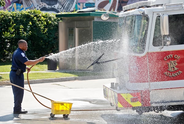 5/11/18 - Atlanta - Atlanta Fire Department Sergeant Count Hammond takes on some cool work in the heat to keep Station 4's equipment in tip top shape.  Friday afternoon's high temperature was expected to reach 89 degrees before hitting the 90-degree mark Saturday and Sunday. Bob Andres / bandres@ajc.com