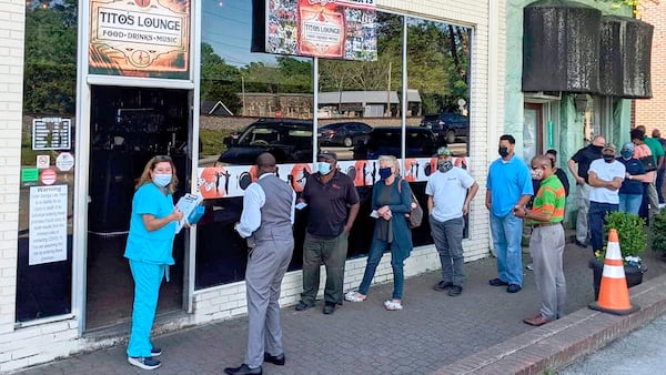 Premier Drugstore's most successful outside vaccination clinics have been at Tito's Lounge in Douglasville.  The lounge made up slogans like "Get your shot, Have a shot." (Courtesy of Bryan Green)