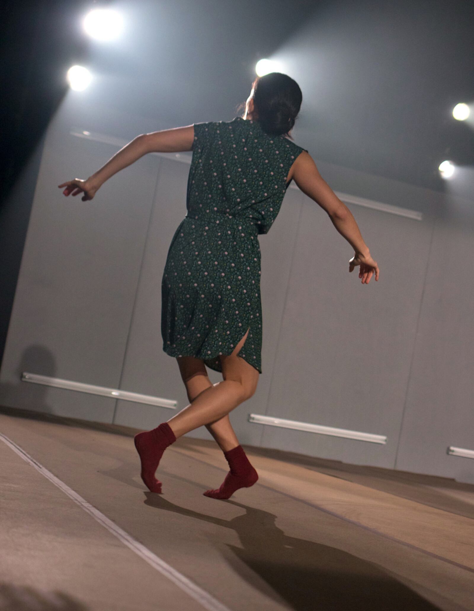 The work began with the dancers, among them Rachel Van Buskirk, facing the back wall. (Photo by T.M. Rives)