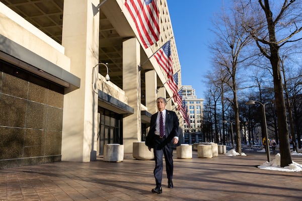 Outgoing FBI Director Christopher Wray walks outside the J. Edgar Hoover Building for an interview with the AJC in Washington, D.C. on Sunday, January 12, 2025. (Arvin Temkar / AJC)