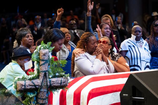 Chantemekki Fortson, center, mother of Senior Airman Roger Fortson, grieves during the funeral for her son at Missionary Baptist Church in Stonecrest on Friday, May 17, 2024.   (Ben Gray / Ben@BenGray.com)